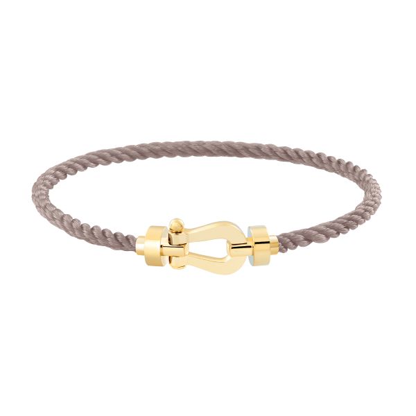 Bracelet Fred Force 10 moyen modèle en or jaune et câble taupe